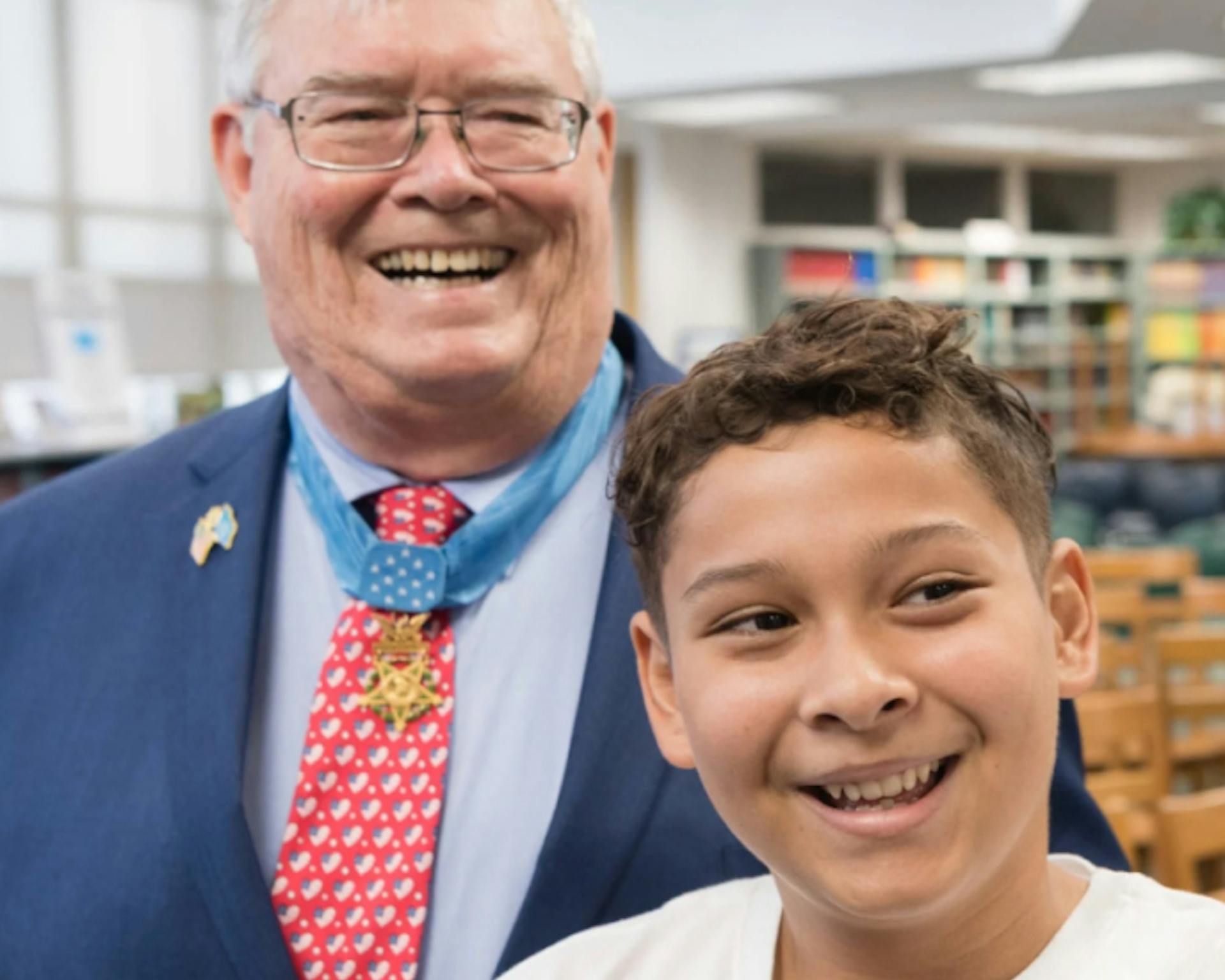 Medal of Honor Recipient and Child smiling